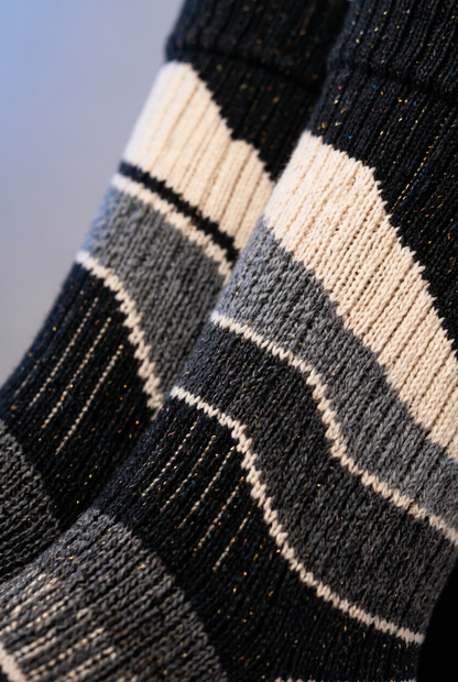 Sloping ivory gray charcoal contour-band knit detail