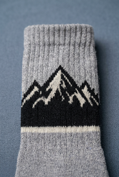 Black mountain motif with light jagged peak detail